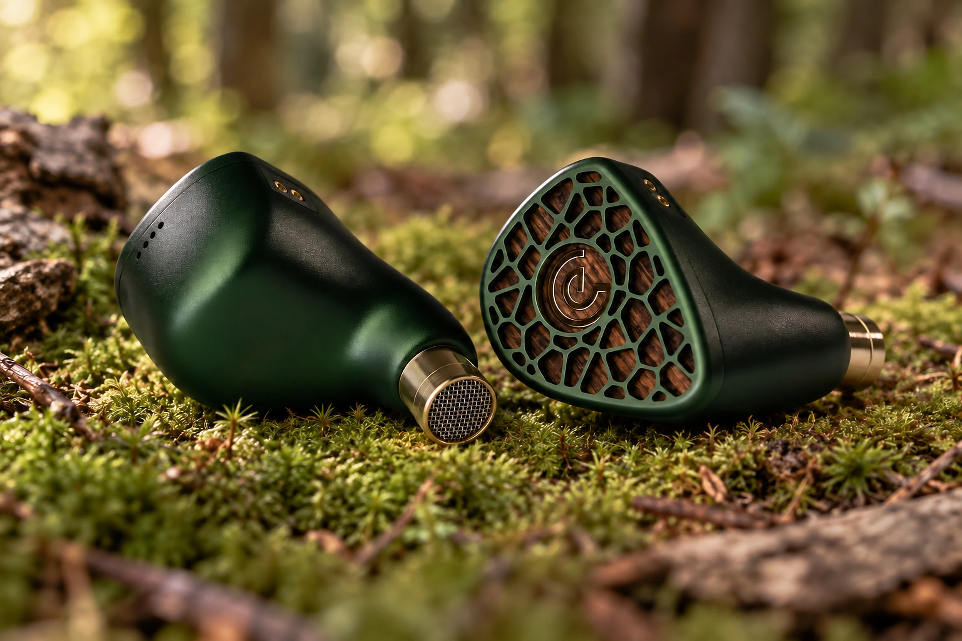A pair of Leszy in-ear monitors on forest moss