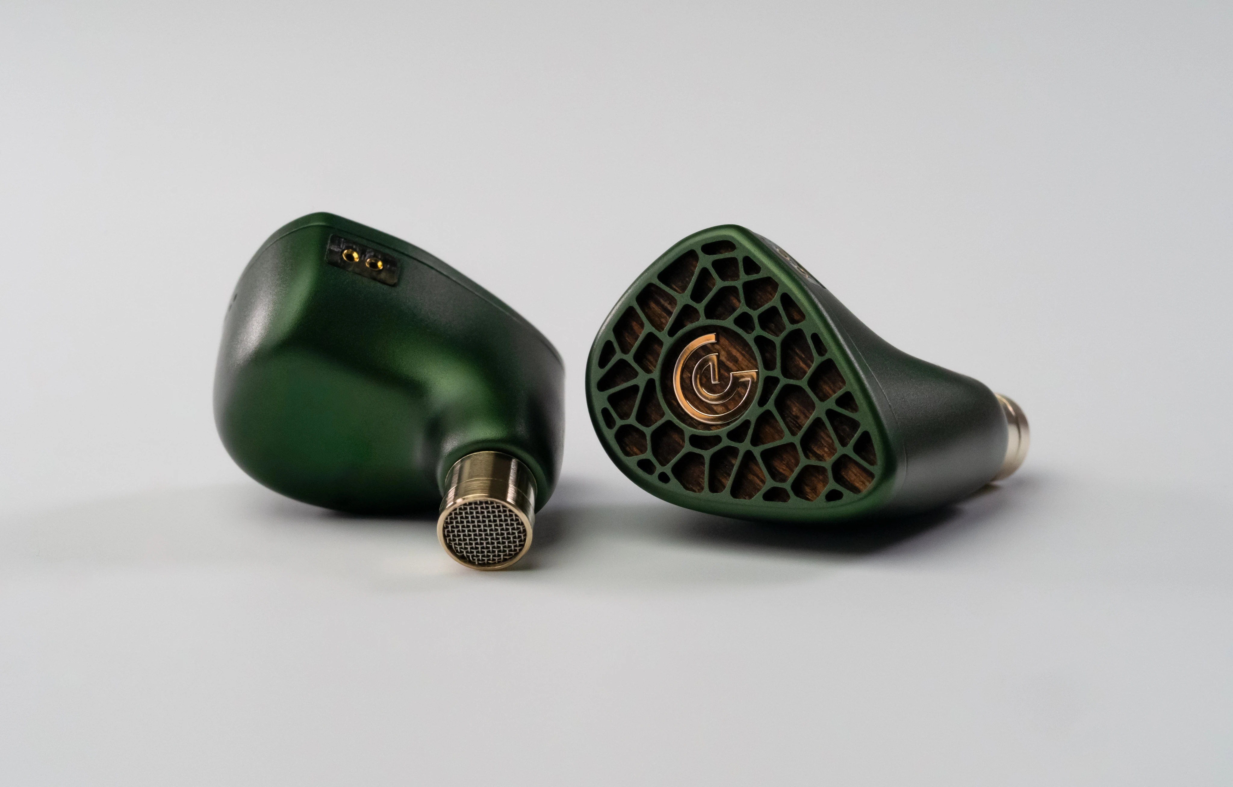 A pair of Leszy in-ear monitors on a light background